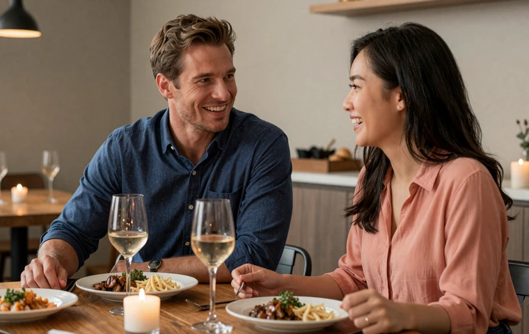 Western man and Asian woman enjoying a cross-cultural dinner date with warm candlelight