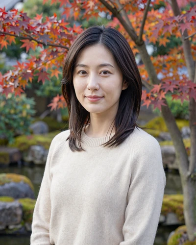 Japanese woman Yuki from Osaka in a cream sweater at a traditional garden