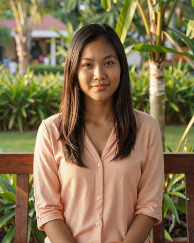 Verified Cambodian woman Dara from Phnom Penh in a tropical garden setting