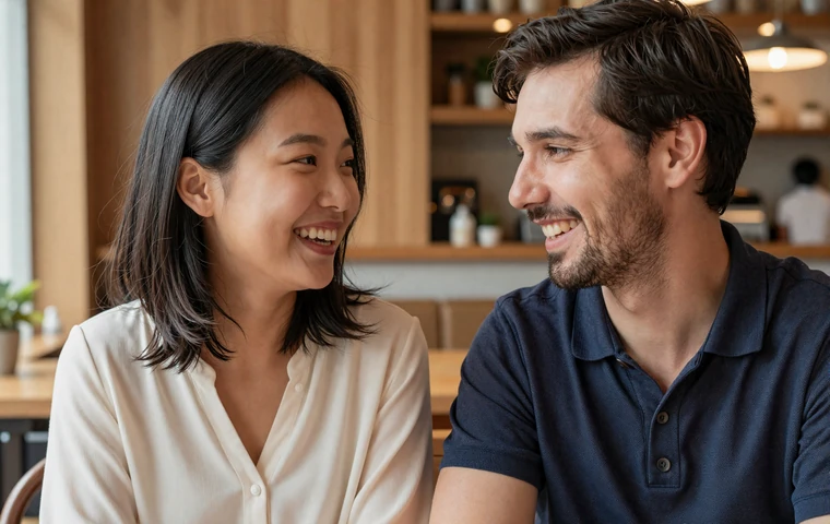 Happy interracial couple laughing together at a cozy cafe during a cross-cultural date