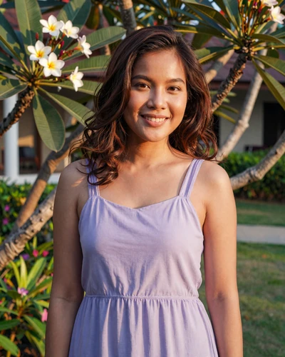 Verified Thai woman Ploy from Phuket in a tropical garden at golden hour