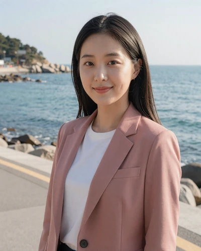 Korean woman Min-Ji from Busan in a dusty rose blazer at a coastal walkway