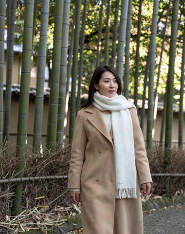 Japanese woman walking through scenic bamboo grove in Kyoto